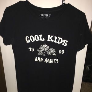 Black tee shirt that says “cool kids bad habits”